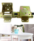 Kickass 90 Degree Folding Self Locking Hinge With Heavy Duty Furniture Foot Bracket Galvanized Metal Iron Dark Bronze Finish For Cabinets That Really Hold Their Ground Smoothly Every Single Time Without Any Hassle displayed with silver metal brackets on a table.