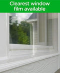 Close-up of Premium Outdoor Patio Door Insulation Wrap For Large Windows And Sliding Doors Clear Plastic Film on window frame.