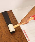 Using Pro Pull Bar 16.25 Inch Long With Three Inch Pull Edge on wood floor with hammer for tight seams