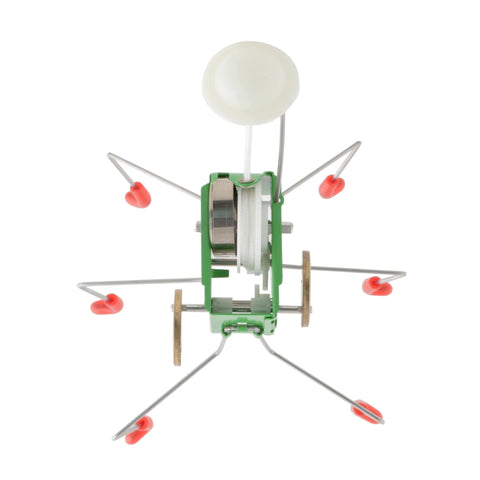 Wind Up Office Desk Pet Toy For Home And Work Cute Dancing Companion in green with metal legs and wind-up action, top view.