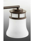 Close-up of Coastal Five Light Chandelier with etched glass shade in antique bronze, part of modern gas light look pendant light.
