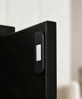 Close-up of a black door with Eight Piece Ultra Thin Magnetic Cabinet Door Catch No Drill Stainless Steel With Strong Hold Quiet Operation.