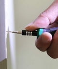 Hand using a screwdriver with a 1600 Pc Heavy Duty Mini Screws 2.5 X 6 8 10 mm Phillips Flat Head to install a screw.
