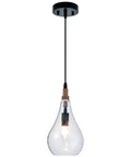 Cozy Farmhouse Seeded Glass Pendant Light With Wooden Teardrop Socket hanging from black cord