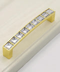 Gold U Shape Crystal Glass Cabinet Knobs Set on white surface
