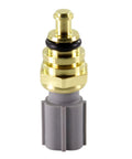 Coolant temperature sensor with brass body and gray plastic connector, close-up view