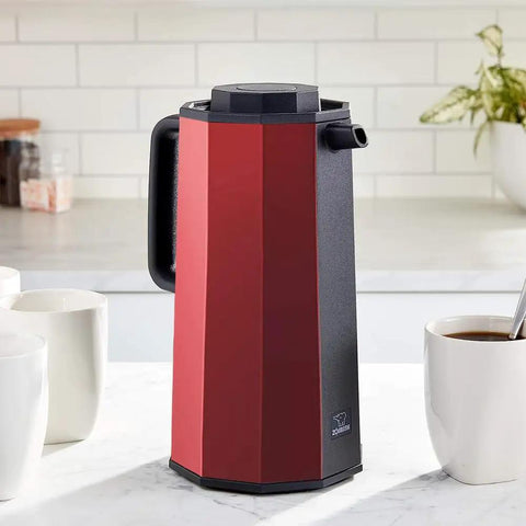 Glass Vacuum Carafe With Thermal Insulation, 1 Liter Capacity, Red, Premium Borosilicate Glass Liner, on kitchen counter