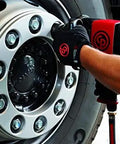 Using Heavy Duty 1 Inch Air Impact Wrench With Beefy Aluminum Housing And Sharp Red Finish on a truck wheel for maintenance.