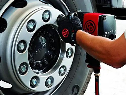 Using Heavy Duty 1 Inch Air Impact Wrench With Beefy Aluminum Housing And Sharp Red Finish on a truck wheel for maintenance.