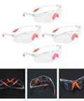 Rugged 4 Piece Set Of Anti Fog Safety Glasses Featuring Rock Solid Polycarbonate Shields And Soft Silicone Gaskets For Heavy Duty Workshop Protection Clear Impact Resistant Eyewear For Pros And Crew in clear with orange accents.