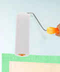 10 Pack White Sponge Paint Roller Covers Replacement Sleeves For House Painting Create Beautiful Texture Finishes With Soft Low Density Sponge Makes Walls Look Awesome Perfect For Large Areas And DIY Craft Nailing The Finish Every Single Time, held above a wall.