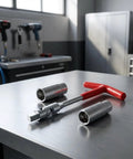 T-Handle Spark Plug Socket Wrench With Swivel Head And Extended 16Mm 21Mm Sockets 3 Piece Set on a workshop table.