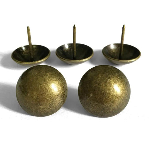 Top Drawer Vintage Brass Upholstery Tacks For Sofas And Headboards One Inch Round heavy-duty decorative nails displayed.