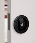 Invisible Barn Wood Sliding Door Lock Hardware With Cup Handle And Keys, Black Finish, 2.95 Inch Diameter on a white door