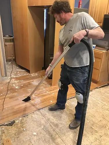 Person using 50 Foot Ultra Flexible Crushproof Commercial Vacuum Hose 1.5 Inch Inner Diameter For Backpack And Canister Vacs in home renovation