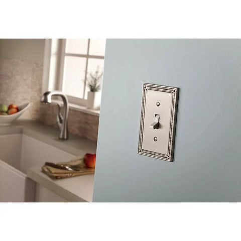 Beaded 1 Gang Duplex Outlet Wall Plate GFI Outlet Cover 3 Pack ETL Certified Modern Brushed Nickel Finish Decorative Electrical Wall Plate with Vintage Bead Detailing for a Timeless Classic Look installed in a kitchen setting with light blue wall