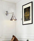 Heavy Duty Adjustable Wall Sconce With Sleek Up Down Shade And E27 Socket For Bedroom Reading Lights And Hallways in metal finish.