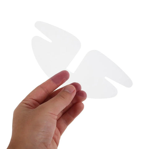 50 Piece Pvc Butterfly Collar Stays Double Layer Shirt Inserts in a hand, clear PVC material for a sharp fit.