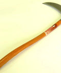 Curved-handled sickle with a wooden handle and metal blade for harvesting and cutting brush.