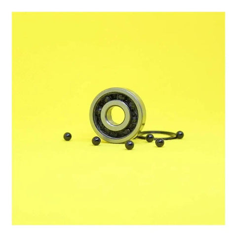 JANURSDHA 6200 Hybrid Ceramic Bearing Set 10x30x9mm ABEC-1 with Si3N4 balls on yellow background for motors and spindles.