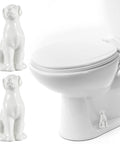Adorable White Ceramic Dog Toilet Bolt Covers Transform Your Bathroom With These Hella Stylish Screw Caps That Bring Real Personality To Your Space While Offering No Sweat Install 2 Piece Set, showing two ceramic dog motifs next to a toilet.