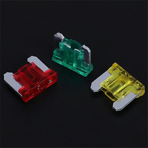 Colorful blade fuses from the 70 Piece Automotive Fuse Assortment Kit With Mixed 5 Amp 7.5 Amp 10 Amp 15 Amp 20 Amp 25 Amp And 30 Amp Blade Fuses For Cars Trucks And Motorcycles Great For Quick Electrical Repairs And DIY Wiring Upgrades on black background.