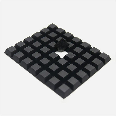 Dead Set Solid Self Adhesive Rubber Feet Pads With Super Sticky Backing Non Slip Furniture Bumpers And Silent Anti Vibration Grips For Sofas And Tables No Wiggle Quick Install 16 Pack Black square rubber feet pads arranged in a grid pattern.