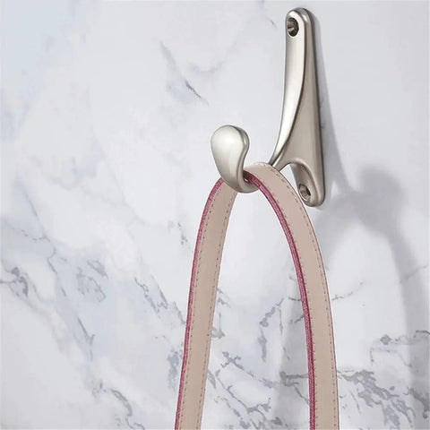 Sleek Wall Mount Coat Rack Built With Rock Solid Zinc Alloy Hooks Perfect For Mudrooms And Halls showing a silver hook with a belt.