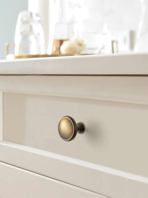 Brushed Bronze Cabinet Knobs 6 Pack Set For Kitchen Cabinets And Dressers Zinc Alloy Drawer Pulls close-up on white drawer