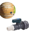 Three Quarter Inch PVC Rain Barrel Spigot Kit With Garden Hose Adapter and bulkhead fitting installed on wooden barrel