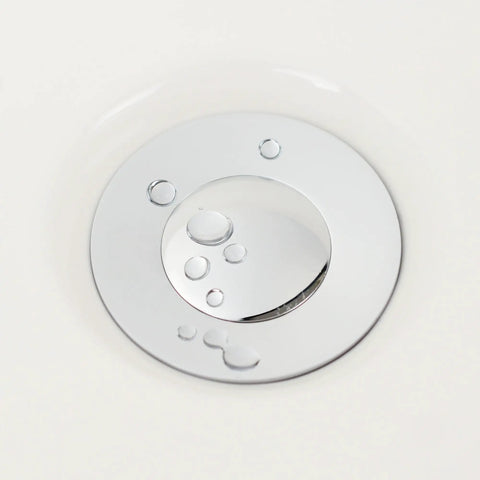 Close-up of Heavy Duty Bathroom Sink Drain Stopper Assembly With Lift Rod And Overflow In Chrome Finish, water droplets visible
