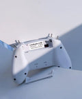 Back view of FrSky D16 LiteRadio 2 SE Transmitter For FPV Drones, USB C Charging, Mode 2, showing battery compartment open.
