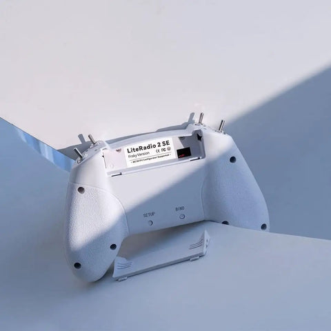 Back view of FrSky D16 LiteRadio 2 SE Transmitter For FPV Drones, USB C Charging, Mode 2, showing battery compartment open.