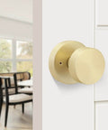 Gold Dummy Door Knobs Set Four Pack Heavy Duty Zinc Alloy With Brushed Gold Finish installed on a white interior door.