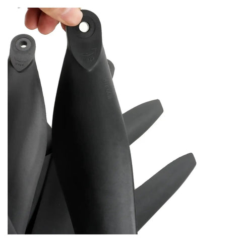 Close-up of Carbon Fiber 3411 Propellers For Drones, CW CCW Matched Pair, Foldable Blades With Precise Hub Interface