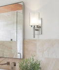 Bold Black 3 Light Vanity Wall Light With Dual Glass Shade Hardwired Indoor Fixture in a modern bathroom setting