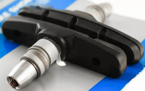 Close-up of Trail-Ready M70T3 V-Brake Shoe Set for Mountain Bikes with Cartridge Style Pads, black finish, no hardware included.