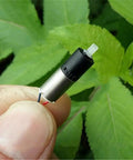 Ultra Tiny 6mm DC 3V Mini Planetary Gear Motor With 1 To 26 Gearbox 1200 RPM Coreless Drive held against green leaves