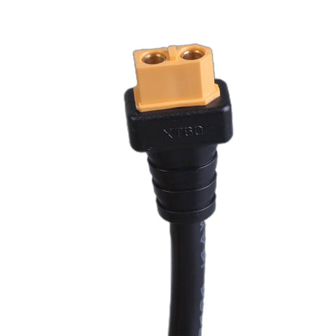 Close-up of Plug And Go Power Extension Cable Car Charging Male To Female Connector with XT60 plug for outdoor use.