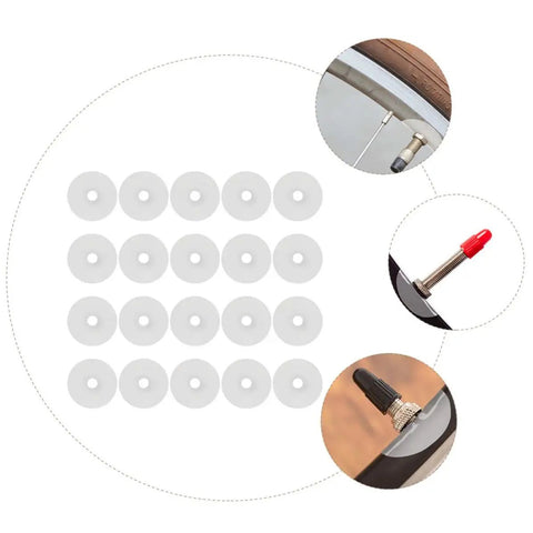 30 Pack Heavy Duty Mountain Bike Valve Stem Pads For Hella Secure Seals And Zero Leaks Quick Swap Tubeless Tire Guard Kit For Sick Rides And Badass Trail Grip, white pads displayed with valve stems.