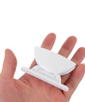 Premium 2 Pack White Rv Door Stop Retainer Tool for Motorhomes in hand, showing plastic material and easy install design.