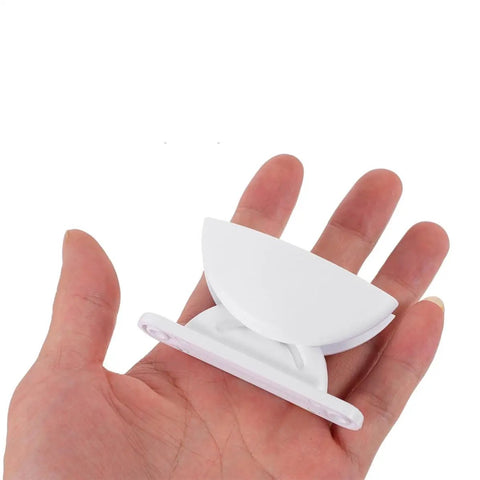 Premium 2 Pack White Rv Door Stop Retainer Tool for Motorhomes in hand, showing plastic material and easy install design.