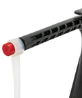 Close-up of adjustable golf swing and hitting trainer arm, showing durable rubber and metal construction, red end cap.