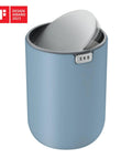 Ultra Compact 1.5L Mini Tabletop Trash Can With Swing Lid For Bathroom Vanity Or Desk Space Saving 4.7 Inch Diameter 6.5 Inch Tall Small Garbage Bin For Office Countertop shown in blue with lid open.