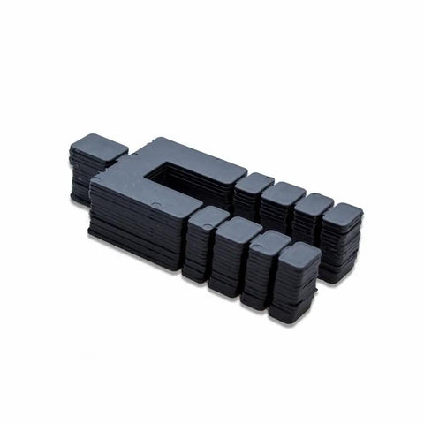 Heavy Duty Stack Shim Levelers For Windows And Doors 4 1/8 X 1 7/8 X 1/16 Inches Rock Solid Black Wedge Spacers 224 Pc Pack arranged in a stack.