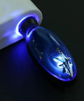 Close-up of Gas Saver Fuel Device Plug In Portable Spill Saver for cars cigarette lighter socket with blue glow