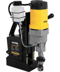 Heavy Duty Magnetic Base Drill Press Rock Solid Shop Workhorse Two Twenty Volt Portable Core Boring Rig For Tough Metal Jobs No Fuss Setup Sweet Performance Day In Day Out with yellow motor and coolant tank.