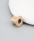 8 Pack Flanged Copper Sleeve Bushings 6 Mm Bore 10 Mm Outer Diameter 12 Mm Length on gray background with a circular object.