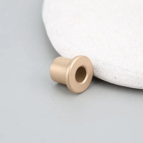8 Pack Flanged Copper Sleeve Bushings 6 Mm Bore 10 Mm Outer Diameter 12 Mm Length on gray background with a circular object.