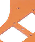 Close-up of orange plastic from the Two Piece Woodworking Corner Radius Template Kit With Router Jig Covering R15 To R200.